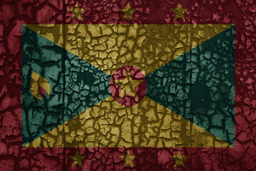 flag of grenada on a old grunge metal rusty cracked wall background