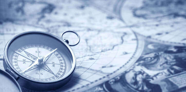 Retro brass compass on old map made by Henricus Hondius in 1636 