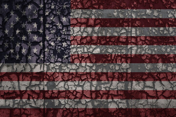 flag of united states of america on a old grunge metal rusty cracked wall background