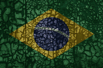 flag of brazil on a old grunge metal rusty cracked wall background