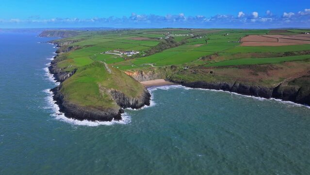 Aerial shot of Welsh coastline and Mwnt promonontry with beach