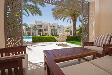 Patio terrace garden with chairs in tropical luxury apartment resort