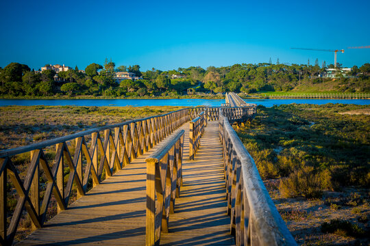 Quinta do Lago Bridge in Ria Formosa natural park in Faro, Algarve in Portugal during sunset