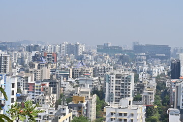Fototapeta na wymiar View of Pune in summer, Cityscape Skyline, buildings holdings, Signboards, and banners, Pune, Maharashtra, India