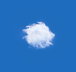 Single cloud isolated over deep blue sky background