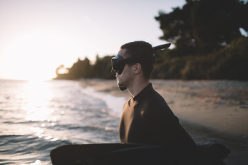 Young active man wear wetsuit , diving mask and snorkel and ready to take a dive