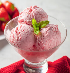 Strawberry ice cream balls in glass cup