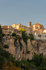 the medieval-style houses of Cuenca, Spain, perched on the edge of a rocky mountain