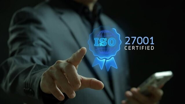 ISO 27001 concept. Requirements, certification, management, standards. Businessman showing identity proofing inside target icon with ISO 27001 for information security management system (ISMS).