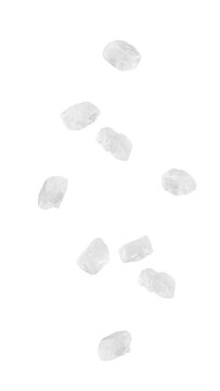 Falling sea salt isolated on white background, full depth of field