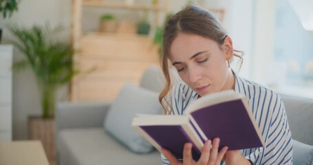 Focused Woman Reading Book