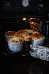 Easter cakes are baked in the oven. I take homemade Easter bread out of the oven.  Happy Easter! 