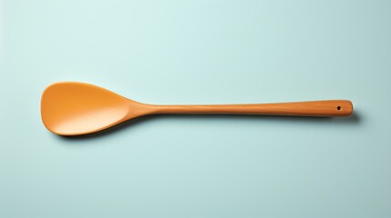 Wooden spoon rests peacefully on blue surface