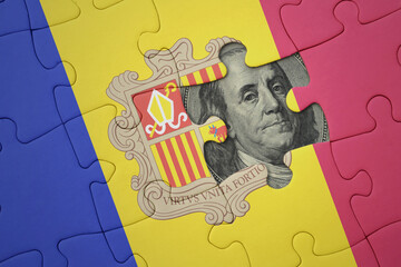 puzzle with the national flag of andorra and usa dollar banknote. finance concept