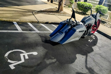 Solomons, Maryland USA A large cruising motorcycle is parked in a handicapped zone.