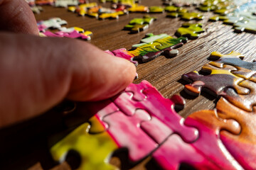 Solomons, Maryland USA A hand works with a puzzle.