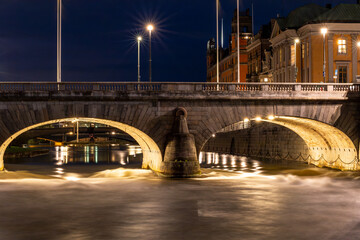 Stockholm, Sweden Fresh water from Lake Malaren rushes under the Norrbro bridge in the Norrstrom...