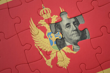 puzzle with the national flag of montenegro and usa dollar banknote. finance concept