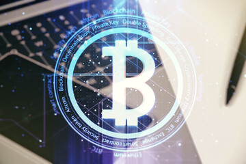 Creative Bitcoin concept with modern laptop background. Multiexposure