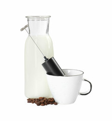 Mini mixer (milk frother), cup, coffee beans and bottle isolated on white