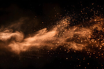 Orange powder explosion on black background
