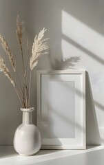 vertical  frame mockup on the table, a beige vase with pampas grass in front of it
