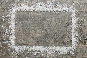 Background from white sea salt. Coarse rock salt texture witth copy space