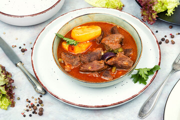 Roast venison with potatoes.