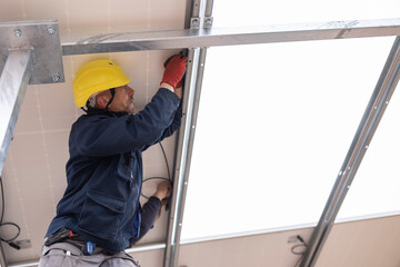 solar panel installer engineer seen from below