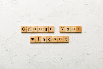 Change your mindset word written on wood block. Change your mindset text on cement table for your desing, Top view concept