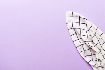 top view with white empty kitchen napkin isolated on table background. Folded cloth for mockup with...
