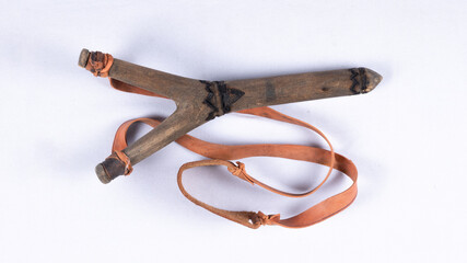 A slingshot or catapult is a small hand powered projectile weapon