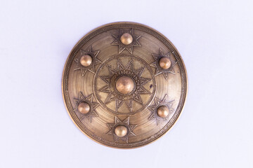 An ancient round shield used by soldiers in war