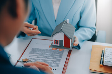 Real estate agent talked about the terms of the home purchase agreement and asked the customer to...