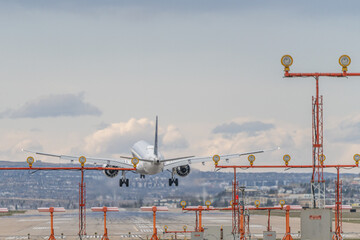 Airplane Jetliner arriving at airport runway