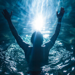 Man who has been baptized raising his arms in joy