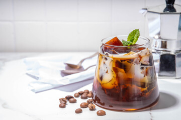 Coffee Jelly Dessert made with strong espresso coffee, gelatin or agar and whipped cream. Asian cold coffee sweets kohii zerii kanten on white table background copy space