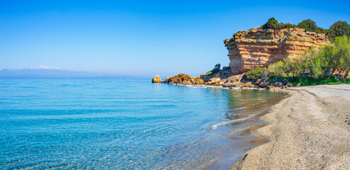 Beautiful beach and water bay in the greek spectacular coast of Peloponnese. Turquoise blue...