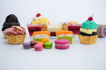 Dessert for afternoon Tea or High Tea , macaron, scone, cake, cup cakes in many color
