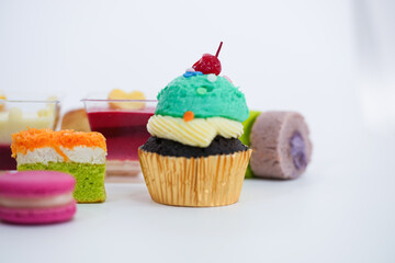 Dessert for afternoon Tea or High Tea , macaron, scone, cake, cup cakes in many color