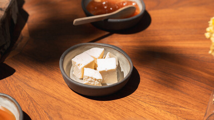 Delicious rich Traditional Turkish breakfast include tomatoes, cucumbers, cheese, butter, eggs, honey, bread, bagels, olives and tea cups. Ramadan Suhoor