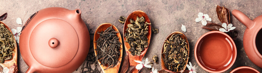 Variety of Loose Tea Leaves and Ceramic Tea Set banner