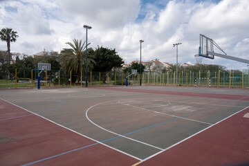 Basketball court in Raanana public park, Israel. Low perspective view from the corner.