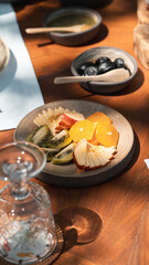 Delicious rich Traditional Turkish breakfast include tomatoes, cucumbers, cheese, butter, eggs, honey, bread, bagels, olives and tea cups. Ramadan Suhoor