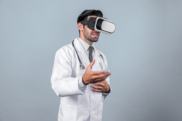 Caucasian smart doctor wearing VR goggles and lab coat while explaining medical theory. Professional doctor analysis medical data while connect metaverse by using visual reality headsets. Deviation.