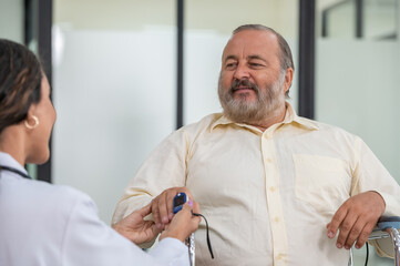 A doctor is checking a patient's blood sugar level.