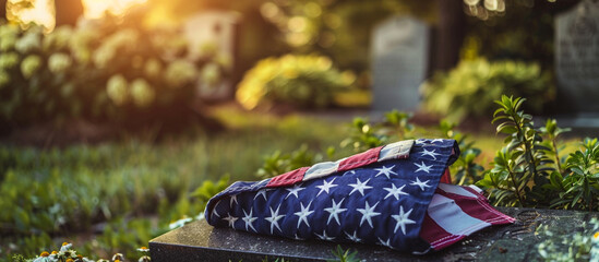 A close-up shot of a folded American flag resting on a soldier's grave on Memorial Day, the high-resolution image capturing the reverence and respect shown to those who made the ultimate sacrifice