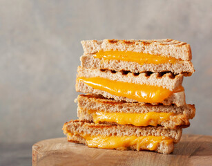 grilled cheese sandwich on wooden board