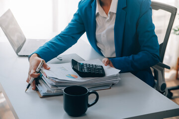 Cheerful business lady working on laptop in office, Asian happy beautiful businesswoman in formal...