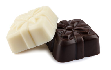 Two beautiful candies made of dark and white elite chocolate isolated on a white background. Art chocolate.
